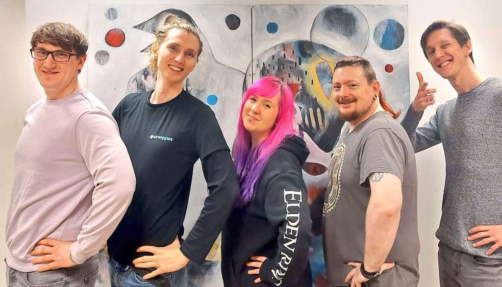 Organisers Alyx (middle), Kev and Liam with their Game Jam Team